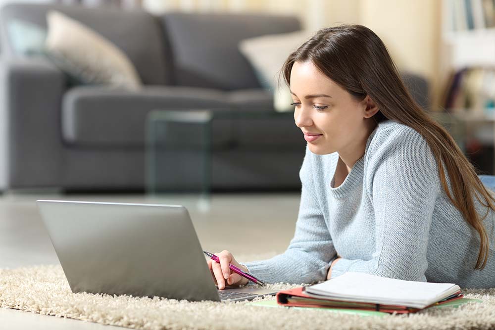 young female student on laptop