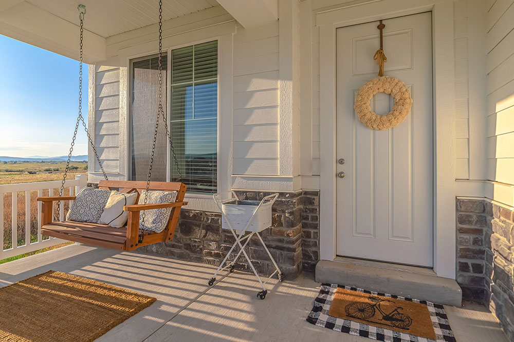 Front porch of home with a porch swing