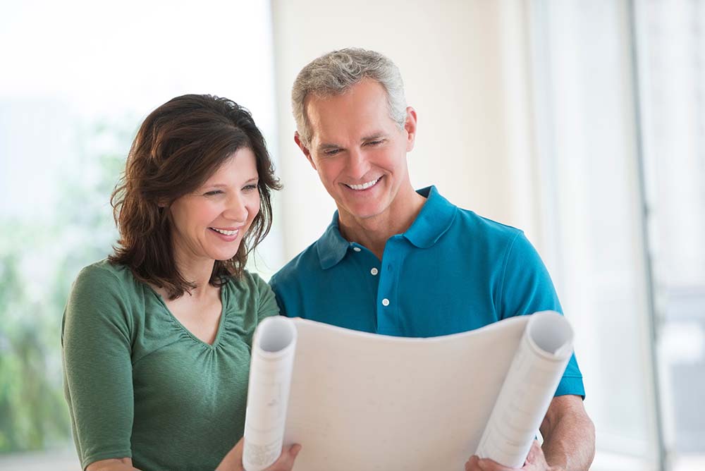 older couple reviewing blueprints together