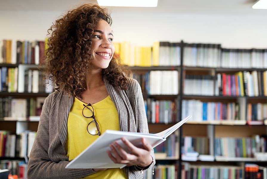 young female student in a library